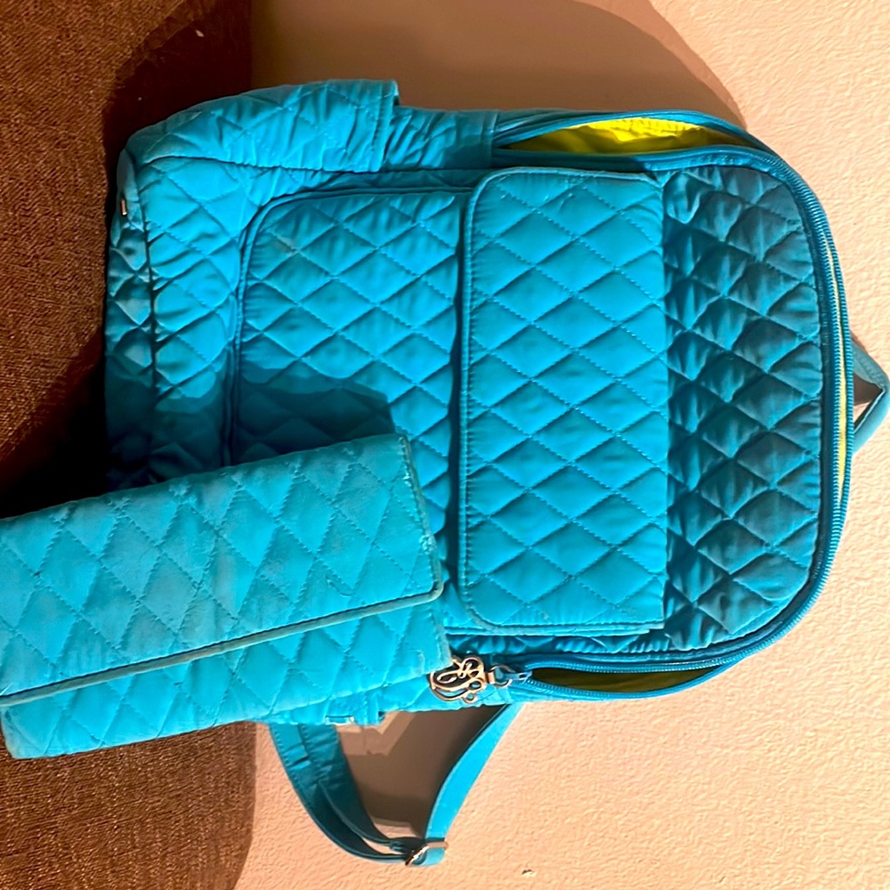 Matching quilted Vera Bradley backpack and wallet.